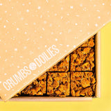 Caramel Cornflake Brownie by Crumbs & Doilies in branded box with crunchy caramel cornflake topping visible.